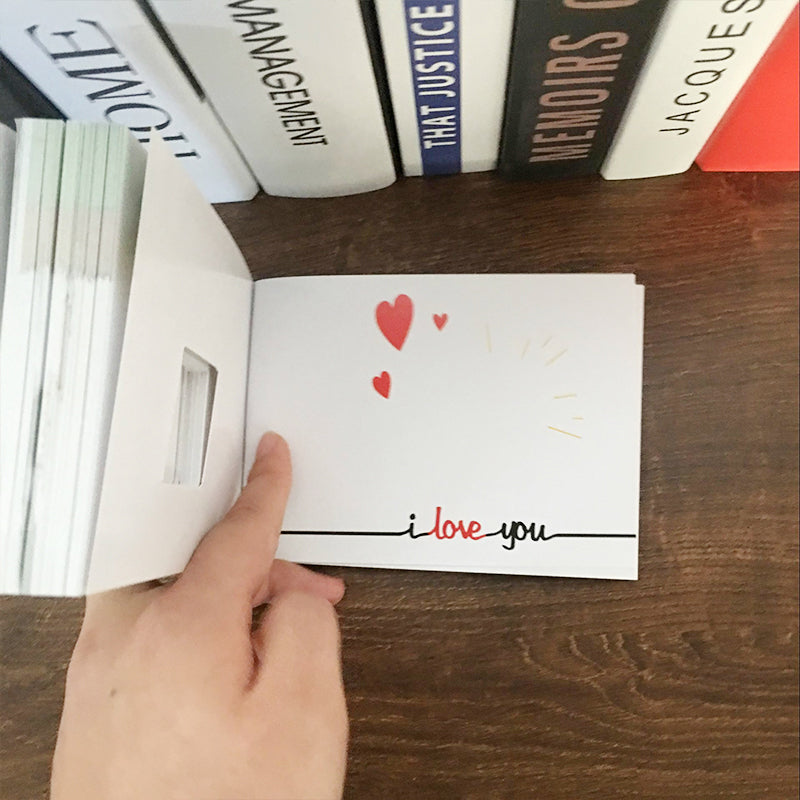 Flipbook with a hidden engagement ring compartment
